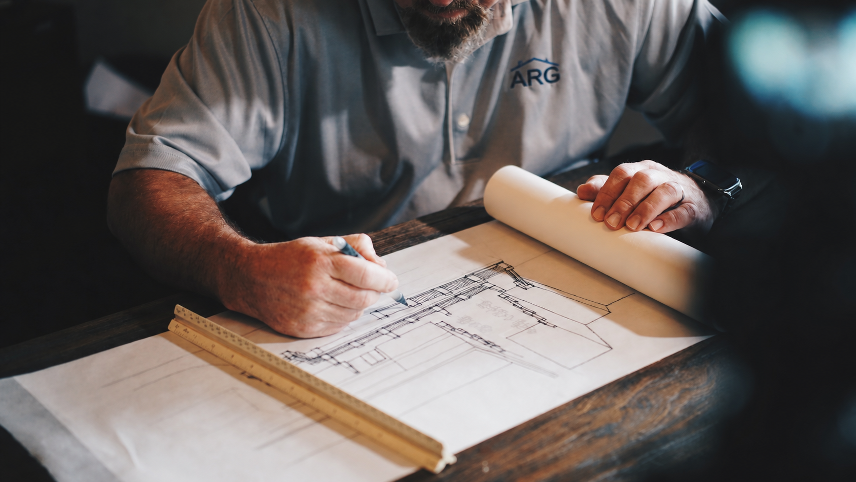 ARG construction professional reviewing residential plans